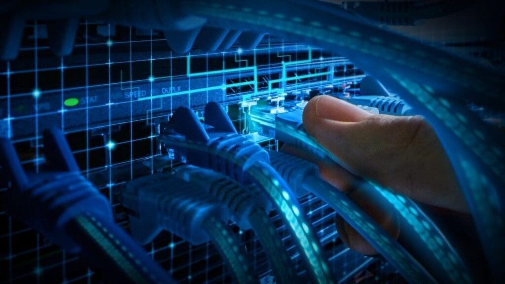 Person plugging ethernet cable into system